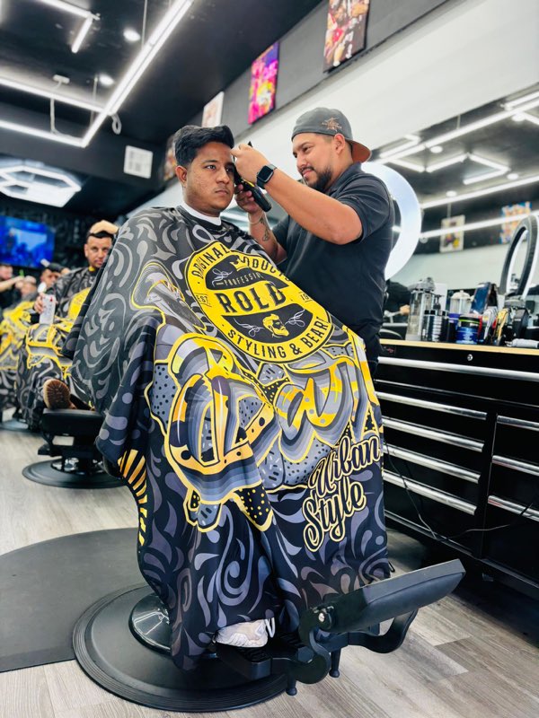 Barber cutting a client in the chair